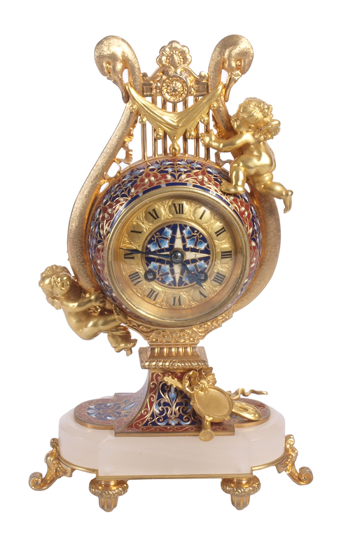 Zeltītas bronzas kamīna pulkstenis ar vairāku krāsu emalju uz kalnu kristāla pamatnes