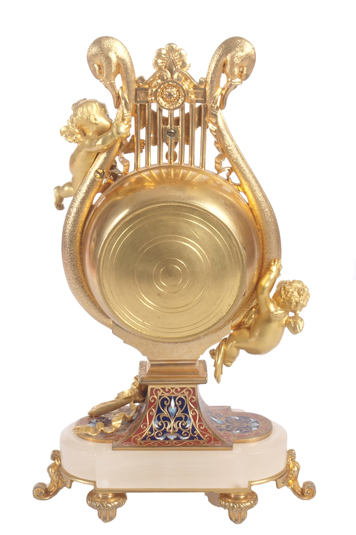 A gilded bronze mantel clock with multi-color enamel on the mountain crystal base
