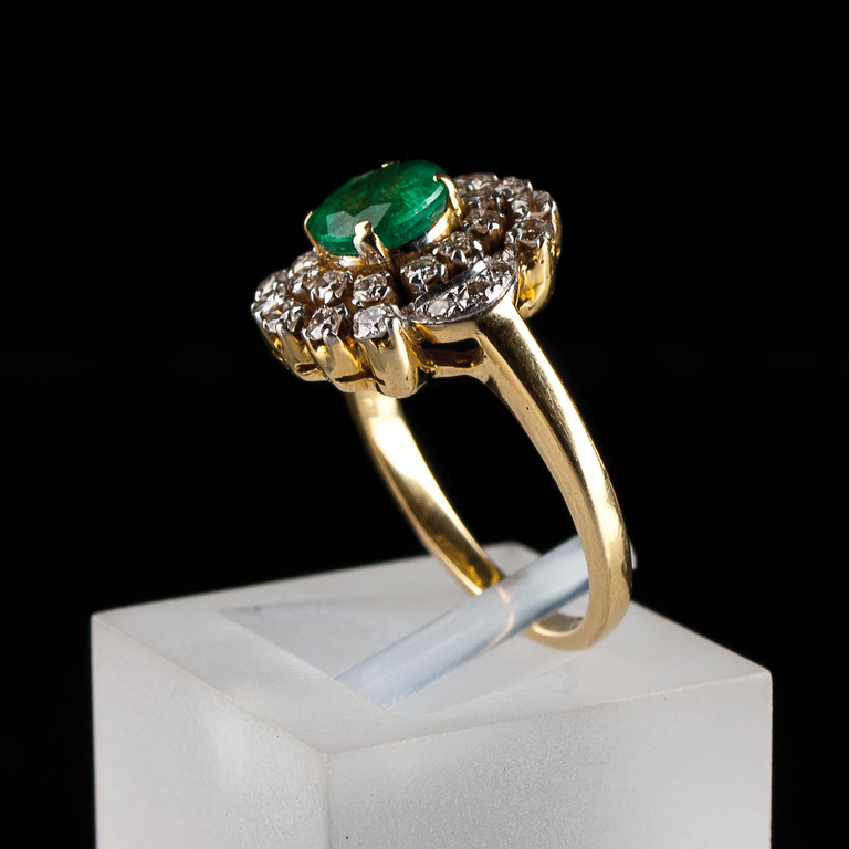 Gold ring with diamonds and emeralds