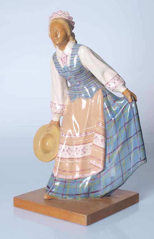 Ceramic figure ”Daughter of the nation” on the wooden base