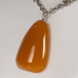 Metal necklace with molten amber pendant