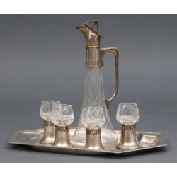 Art Nouveau style decanter with four cups and tray