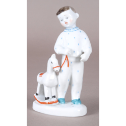Porcelain figure „Child with rocking horse”