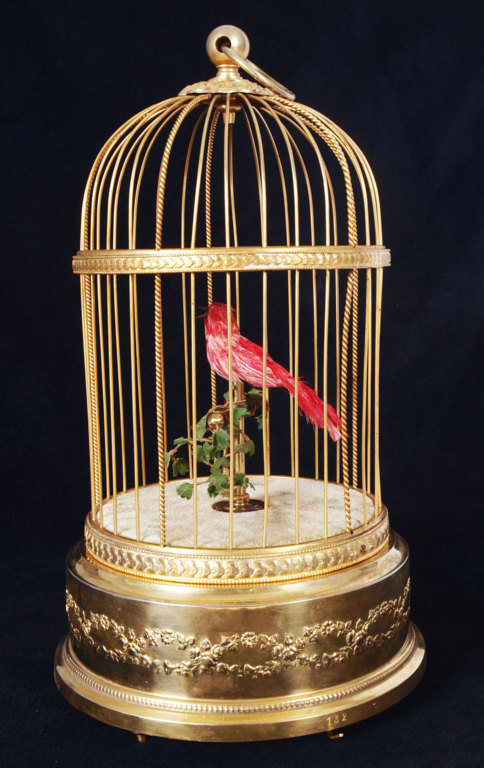Decorative bird cage with a singing bird