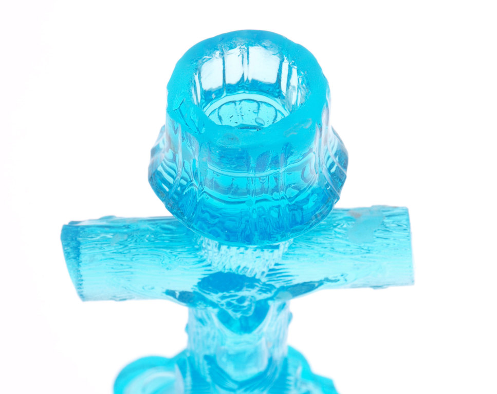 Colorful glass candlestick with a religious theme