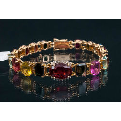 Gold bracelet with brilliants and colourful  tourmalines