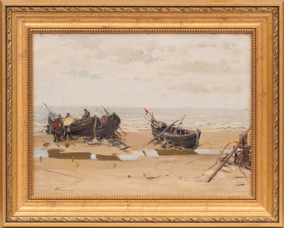 Рыбаки и лодки рыбаков на берегу моря