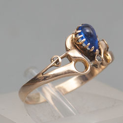 Gold ring with diamonds and blue stone