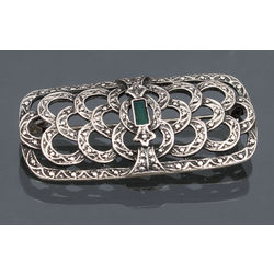 Silver brooch with emerald