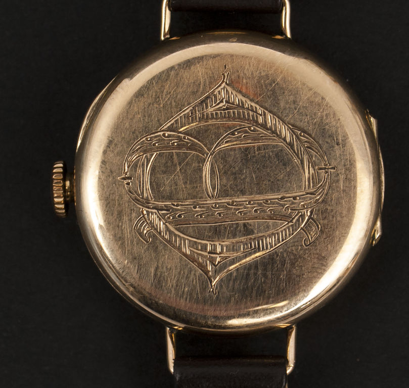 Gold wristwatch with a leather strap David Henry Grandjean & Co
