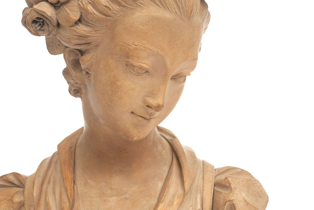 Terracotta female bust on marble base