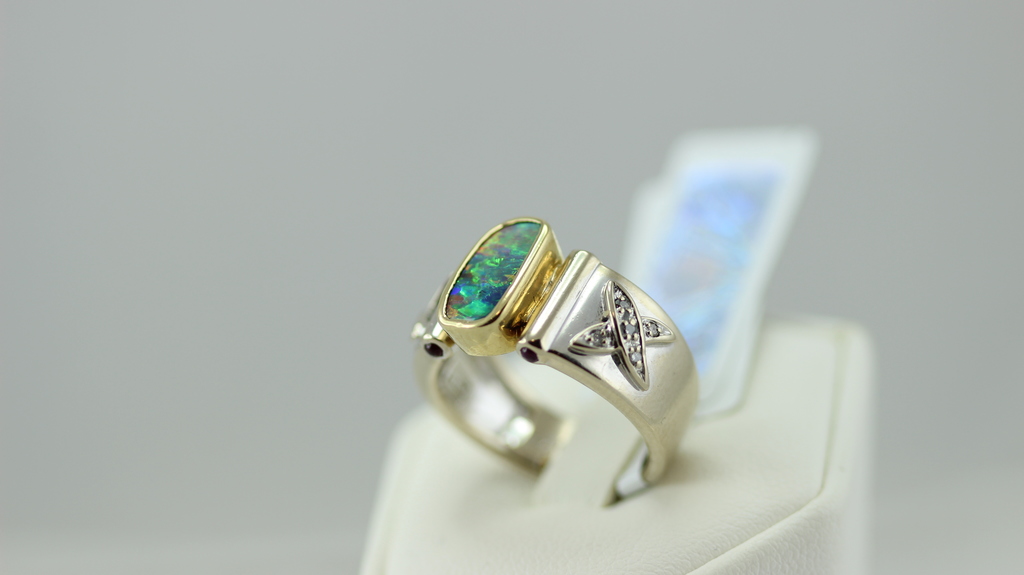 Gold ring with diamonds, opal, matrices and rubies
