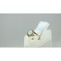 Golden ring with opal