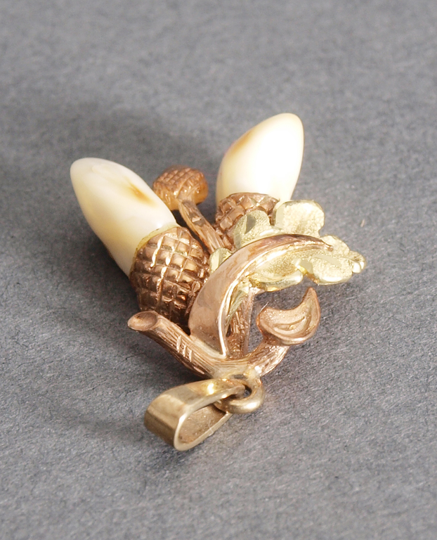 Golden pendant with bone