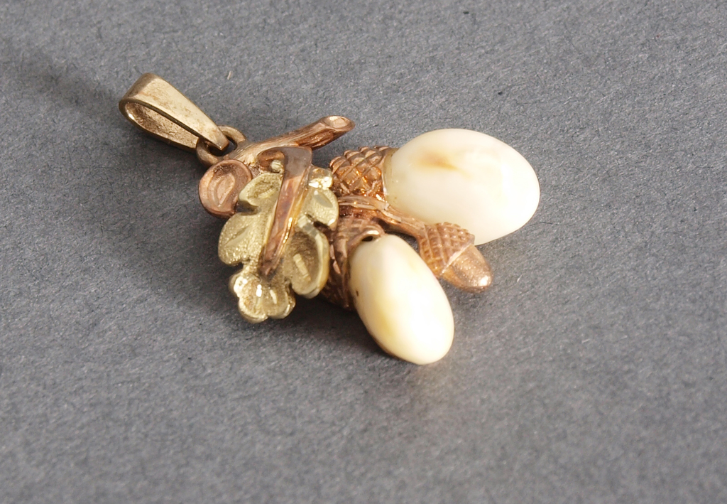 Golden pendant with bone