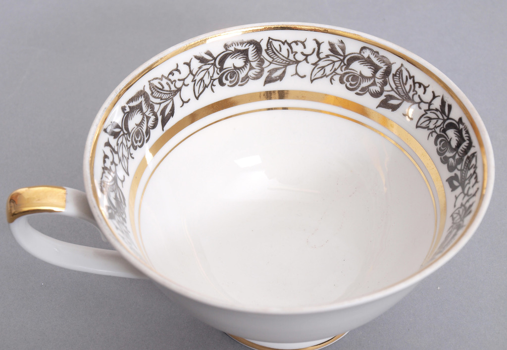 Porcelain cup with saucers