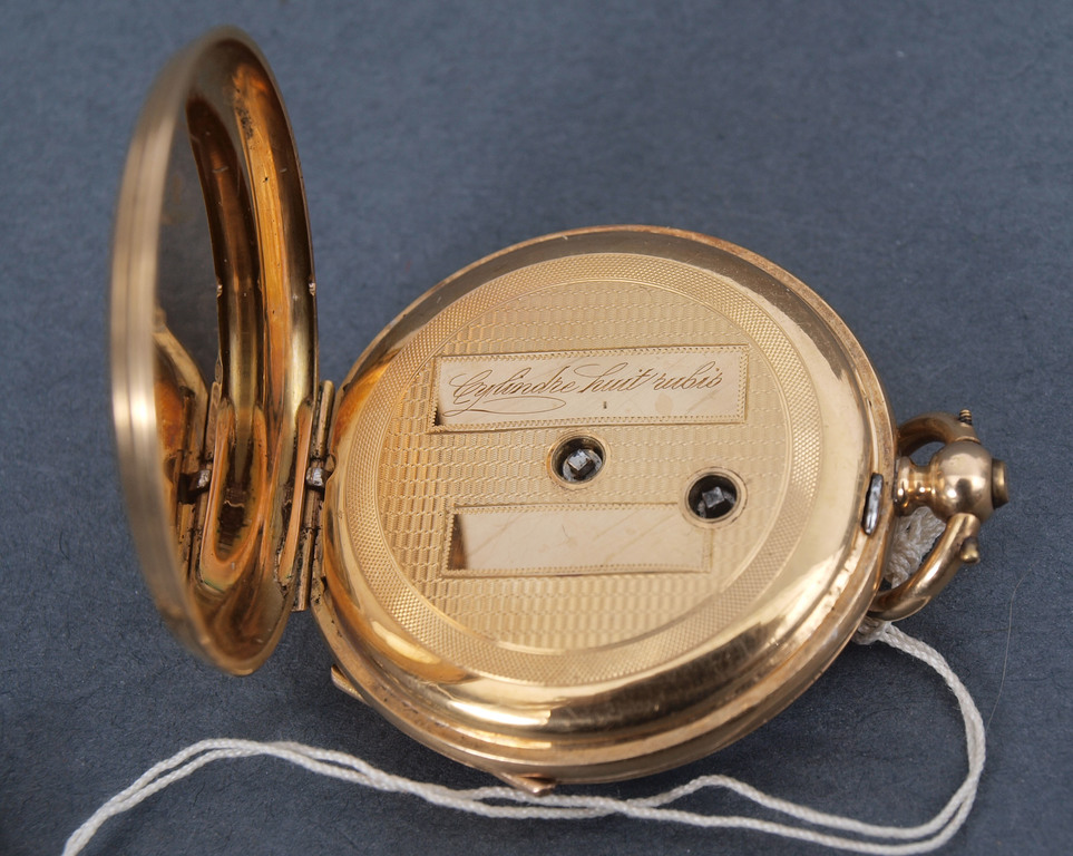 Gold pocket watch with enamel and golden key