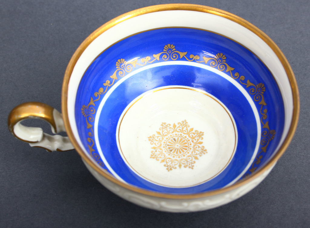 Porcelain cup with saucers