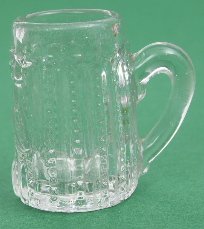 A small glass cup with Jewish symbolism