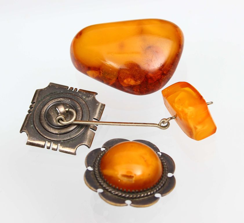 Amber brooches (2 pcs.) and a pendant