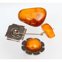 Amber brooches (2 pcs.) and a pendant