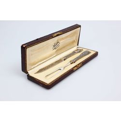 Silver fork and knife in the original box