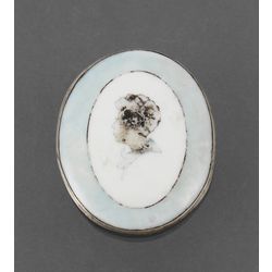 Porcelain brooch with silver finish