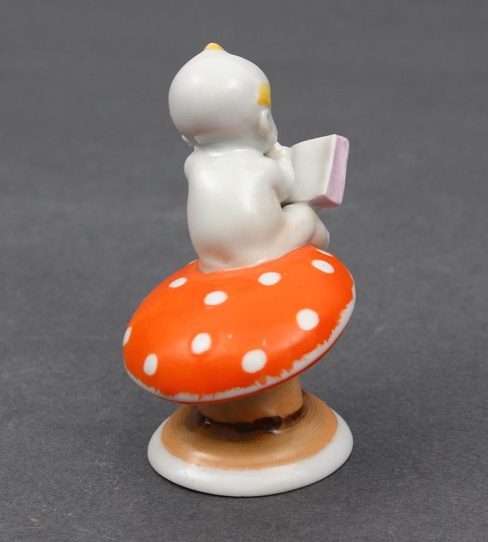 Porcelain figurine Boy on the mushroom