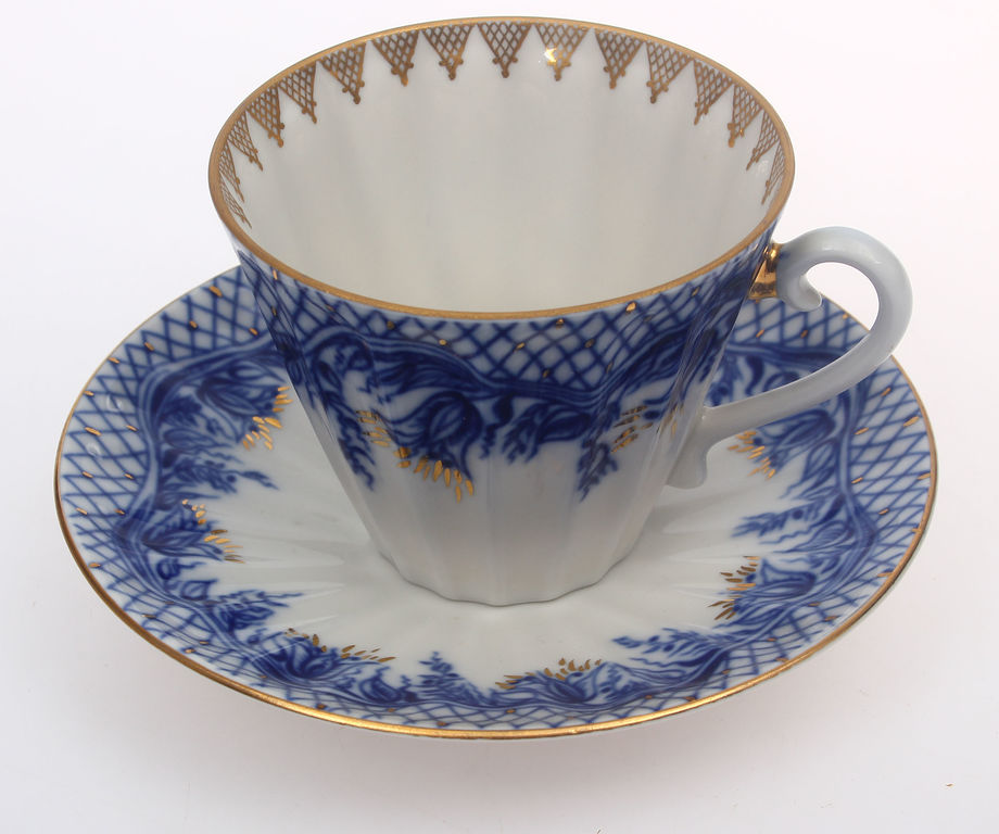 Porcelain mug with saucer