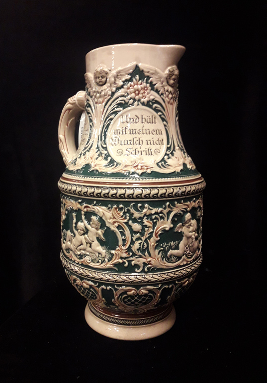 Faience pitcher with inscriptions in German