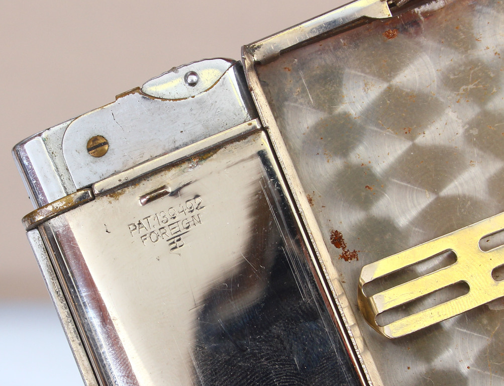 Metal cigarette case with integrated lighter, patent number  