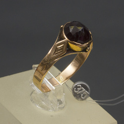 Golden ring with garnet