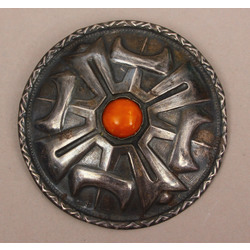 Silver brooch with amber