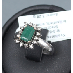 Platinum ring with diamonds and emerald