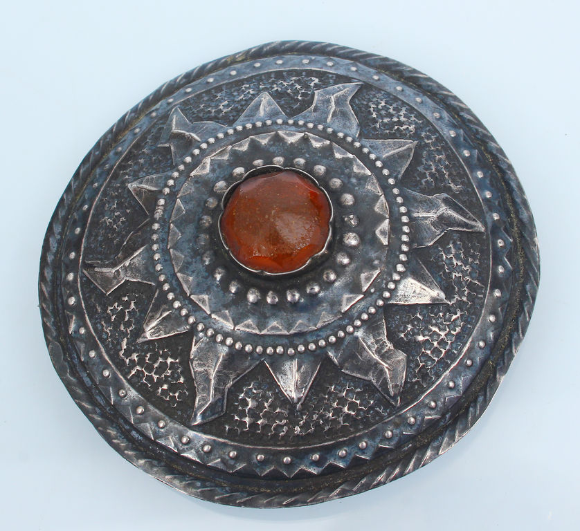 Silver brooch with melted amber 