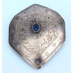 Silver brooch with blue stone 