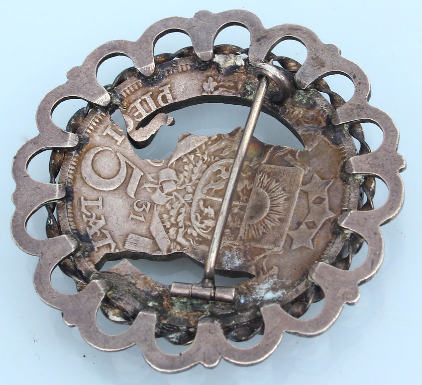 Silver brooch from the five-lat coin with green stones