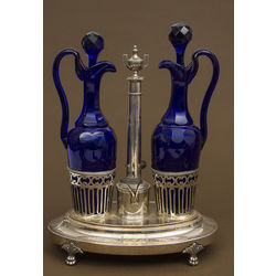 Two decanters for spices with silver tray