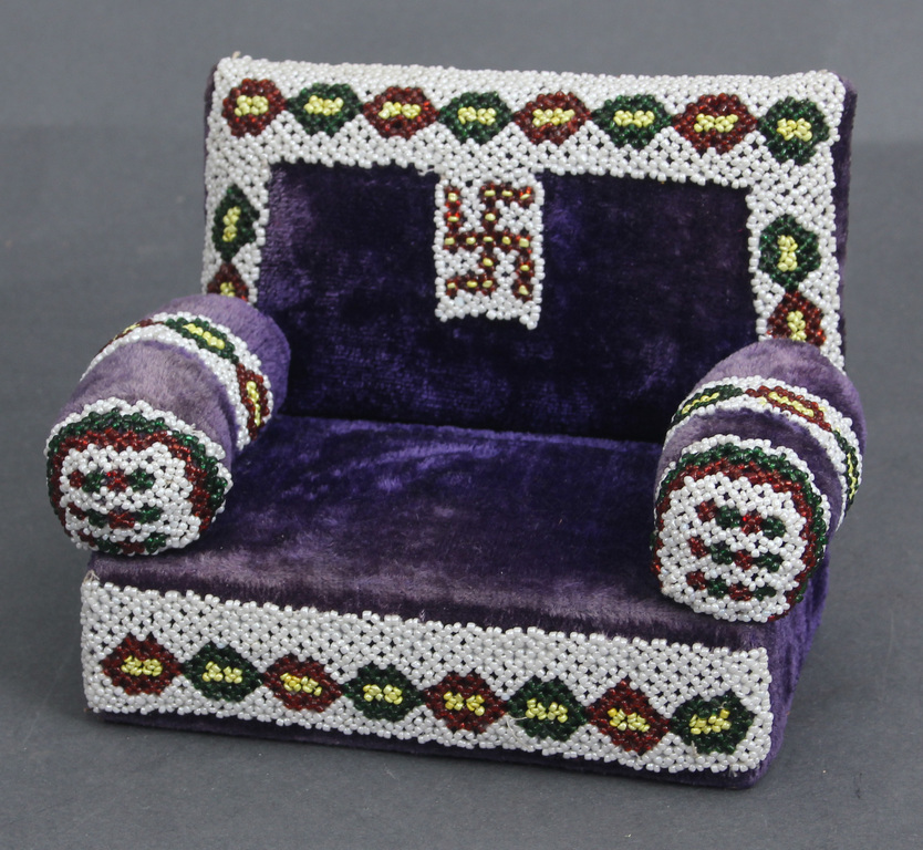 Couch embroidered with beads