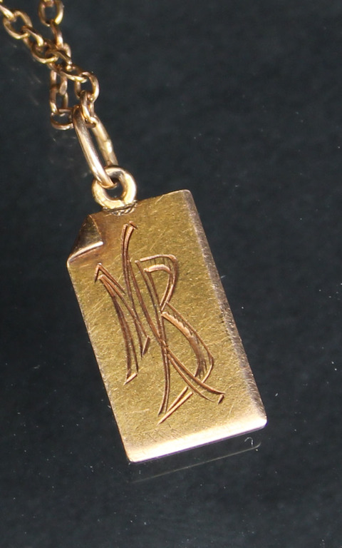 Gold bracelet with pendant