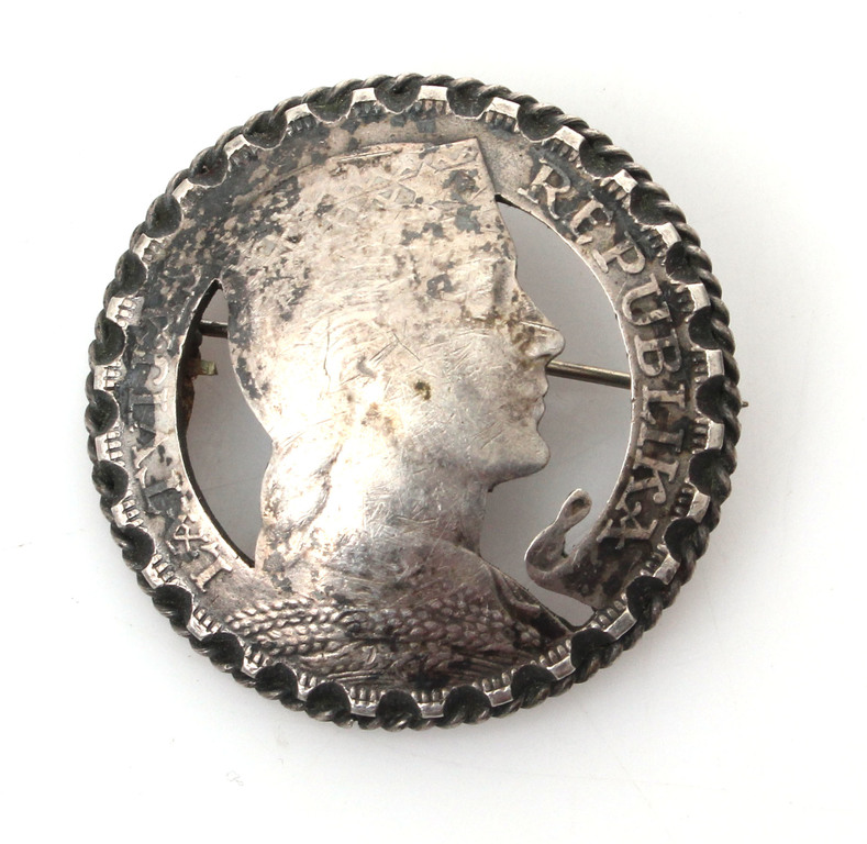 Silver brooch from a five lat coin