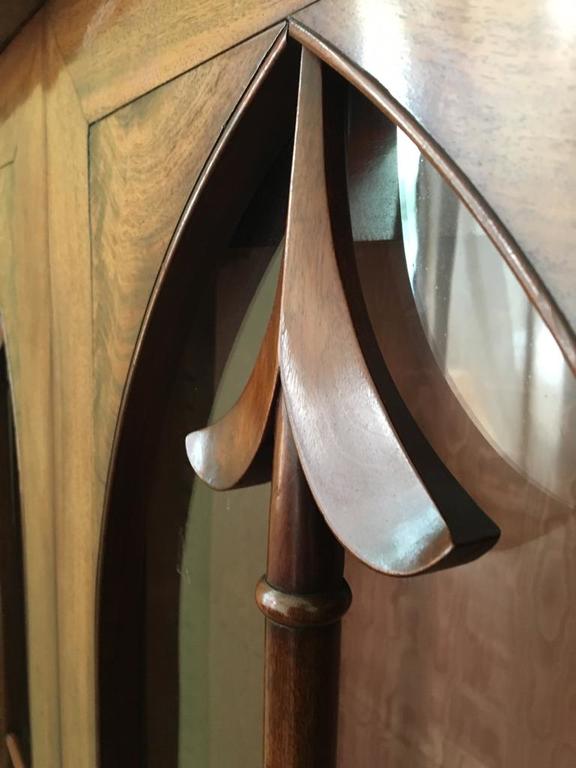 Biedermeier style showcase with spear-shaped door jambs