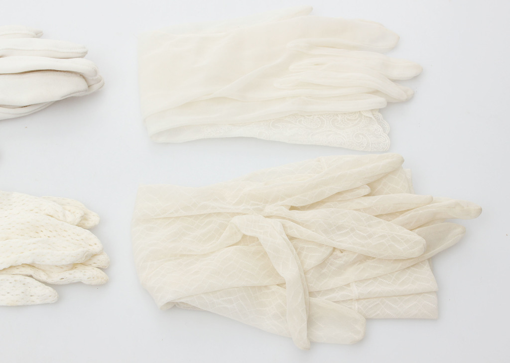 Four pairs of white women's gloves