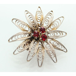 High proof silver brooch with garnets