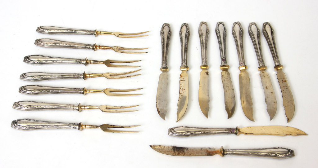 Set of silver dessert forks and knives with gilding