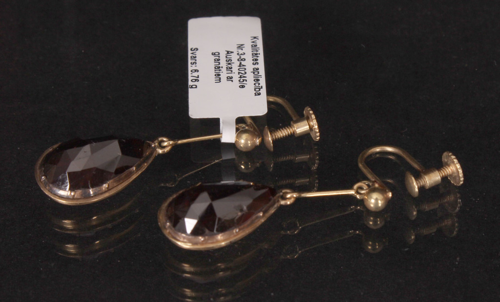 Gold earrings with large garnets