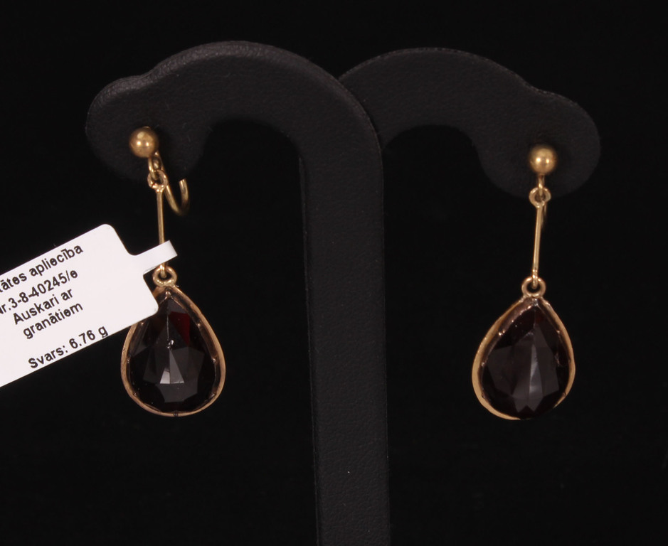 Gold earrings with large garnets
