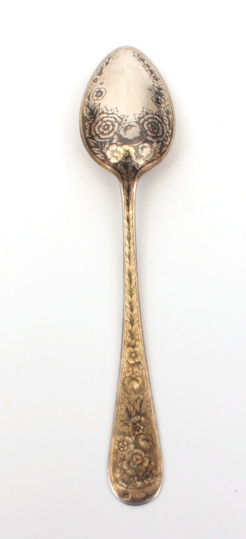 Silver spoon with blackening in a box