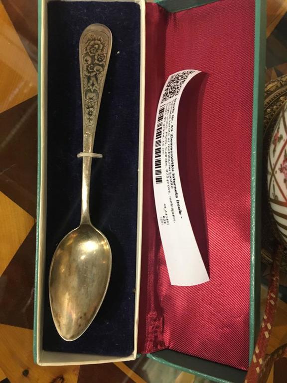 Silver spoon with blackening in a box