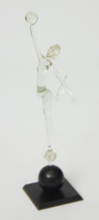 Glass figurine on a wooden base 